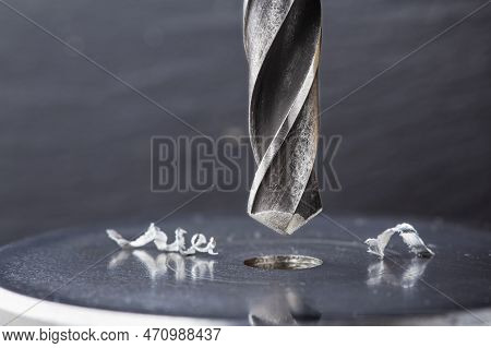 Metal Drill Bit Make Holes In Steel Billet On Industrial Drilling Machine. Metal Work Industry. Mult