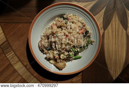 Homemade Holy Basil And Spicy Herb Fried Rice With Shrimps, Squid And Yardlong Bean. Thai Stir Fried