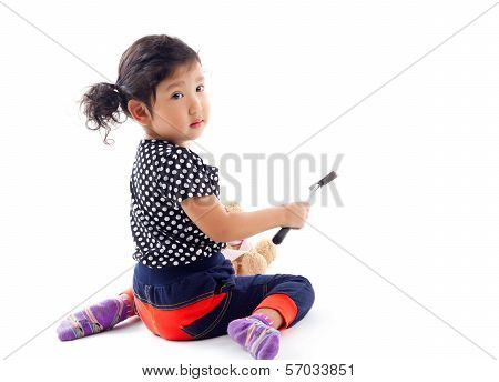 Cute Girl With Hammer And Doll