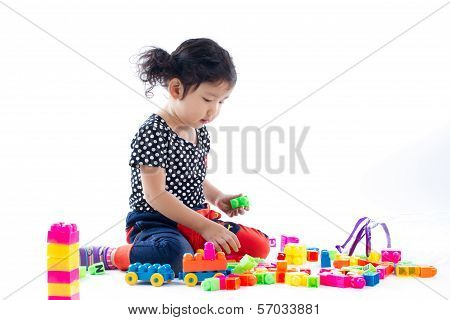 A Cute Child Playing Blocks Toy On White Background