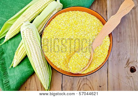 Corn Grits With Corn Cobs On A Board