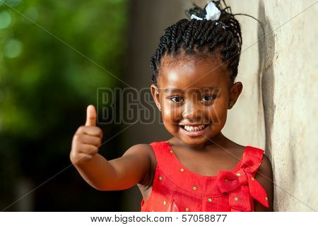 Pretty Little African Girl Showing Thumbs Up.