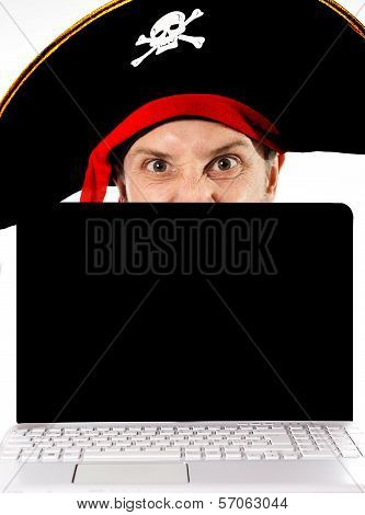 Young Man In Pirate Costume And Computer