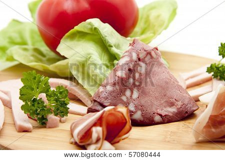 Fresh Raw and Cooked Ham with Cold Cuts from Blood Sausage