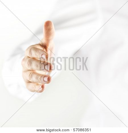 Man Extending His Hand In A Handshake