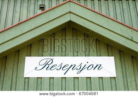 Reception Sign On A Green Wooden Wall In Norwegian Language