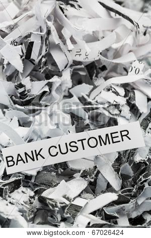 shredded paper tagged with bank customer, symbol photo for data destruction, customer data and banking secrecy