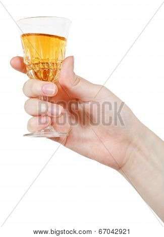 Hand Holds Wineglass Of Aperitif Wine
