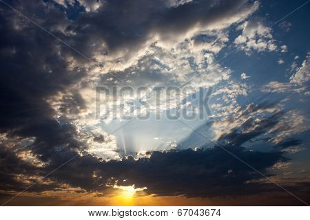 Cloudscape With The Sun Rays Radiating From Behind The Cloud