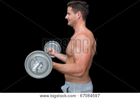 Happy handsome crossfitter lifting up barbell on black background