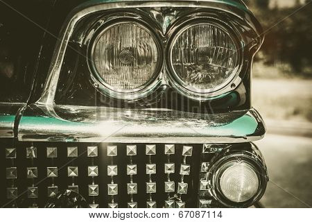 Close-up of retro car facia with chrome grille