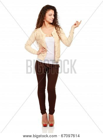 portrait of pretty happy young woman pointing at copyspace, isolated on white background