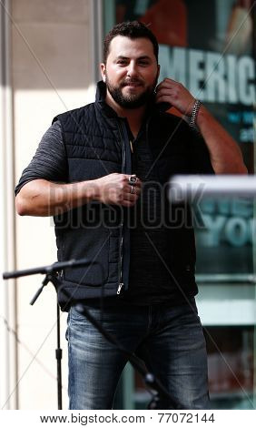NEW YORK-AUG 22: Country music singer Tyler Farr performs at Fox and Friends' All-American Summer Concert Series on the corner of 48th Street and 6th Avenue on August 22, 2014 in New York City.