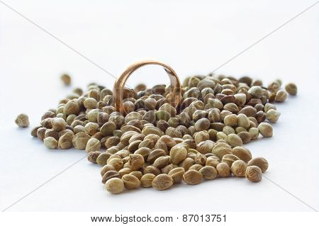 Hemp Seeds And Golden Wedding Ring