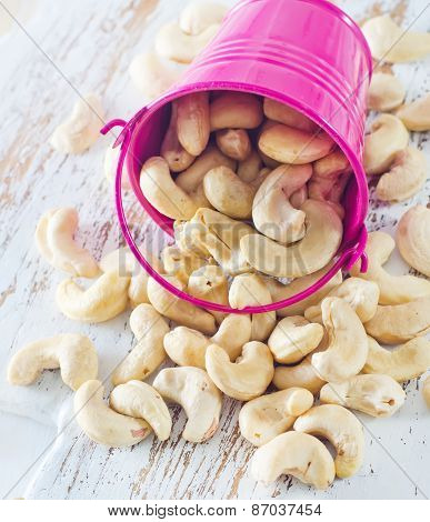 cashews in a little bucket pink