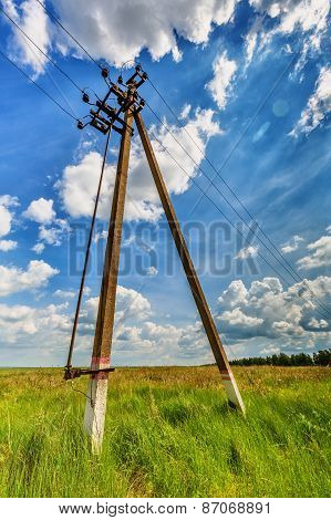 Powerline and cloudy sky