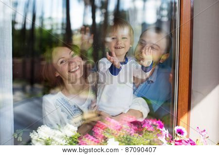 Young Attractive Parents and Child Portrait indoors