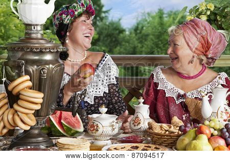 Women Drinking Tea Outdoors