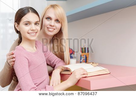 Mother and daughter studying