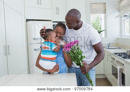 Happ couple with his babyboy in the kitchen