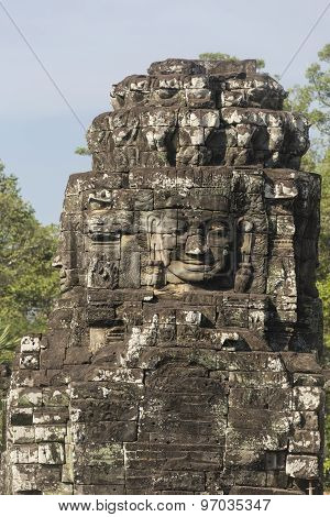 Ancient Stone Faces Of King Jayavarman Vii At The Bayon Temple, Angkor, Cambodia