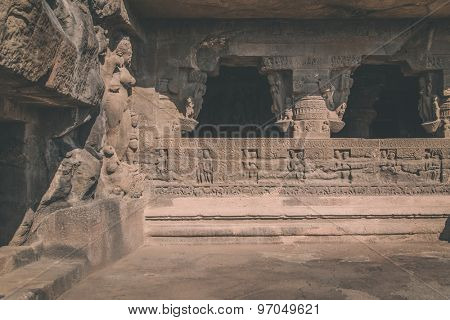 ELLORA, INDIA - 14 JANUARY 2015: Ellora Caves is an archaeological site close to city of Aurangabad. Ellora is a World Heritage Site. Processed with grain, texture and color effect.