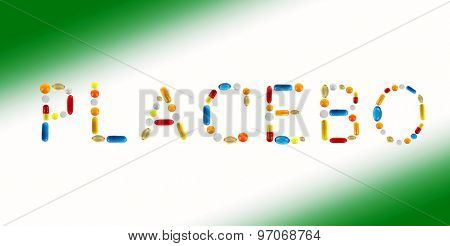 The word Placebo made with pills on color background