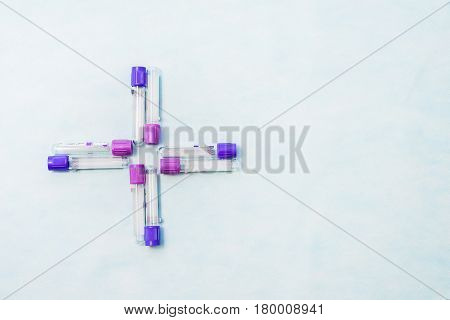 Test tubes for laboratory diagnosis blood tests on a blue background.
