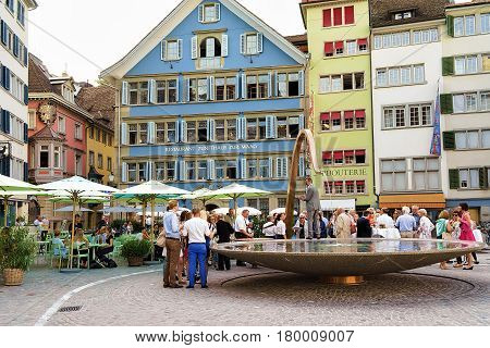 People And Fountain On Square Munsterhof In Zurich