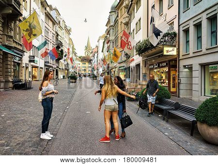 Teenagers At Rennweg Pedestrian Street And St Peter Church Zurich