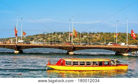 Excursion Ferry On Geneva Lake And Bergues Bridge With Flags