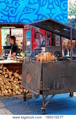 Prague Czech Republic - June 10 2012: Shank cooking booth in Old town of Prague Czech Republic. Chief on the background