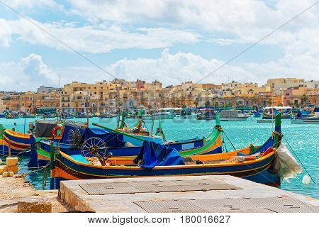 Luzzu Colorful Boats At Marsaxlokk Bay On Malta