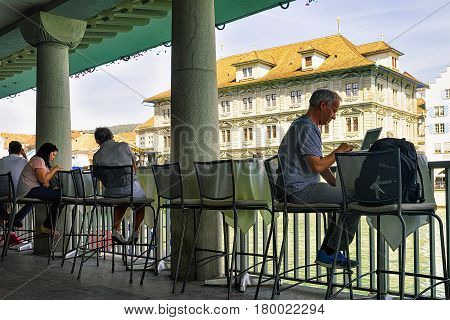 People Relaxing At Old Town Hall At Limmat Zurich Swiss
