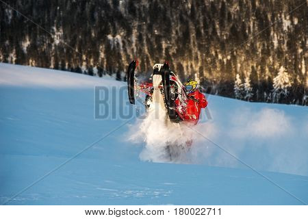 Rider on the snowmobile in the mountains ski resort in Amut Russia.