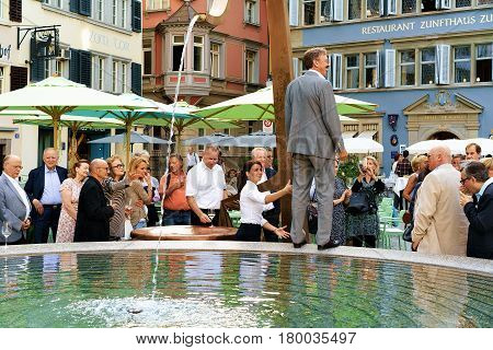 People And Fountain At Munsterhof Square Zurich