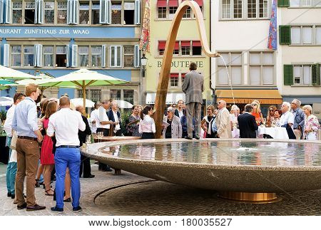 People And Fountain On Munsterhof Square In Zurich