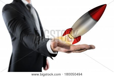 Businessman holding a small rocket. Startup working enterprise concept