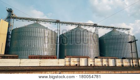 Metal grain elevator inagricultural zone farm field