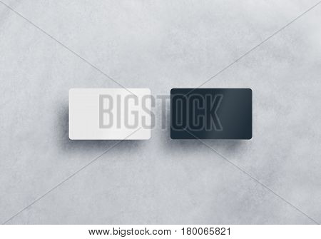 Two blank plastic business cards mockups set isolated on grey textured background. Black and white namecard design mock up presentation. Empty horizontal visiting sheets template with shadows.