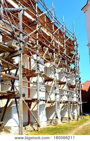 Old Fortified Medieval Saxon Church In Dirjiu, Transylvania In Reconstruction