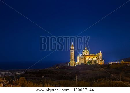 Gozo Malta - The Basilica of the National Shrine of the Blessed  Ta' Pinu at night with clear starry sky on a summer night
