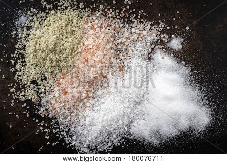 Salt selection as close-up on brown background