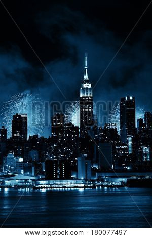 NEW YORK CITY - JUL 4: Empire State Building with fireworks on July 4, 2015 in Manhattan, New York City. With population of 8.4M, it is the most populous city in the United States.