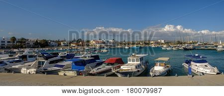 Panorama shot of the marina at Zygi, Cyprus, shows a full view of the habour and village behind.