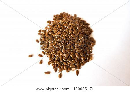 Handful of flax seed on neutral background