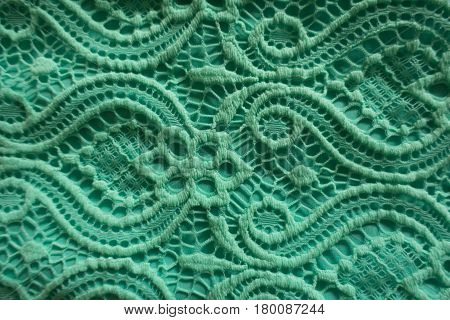 Close up of mint lace perforated fabric