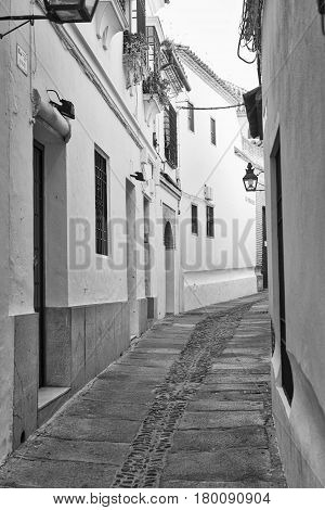 Cordoba (Andalucia Spain): old typical street in the Juderia. Black and white