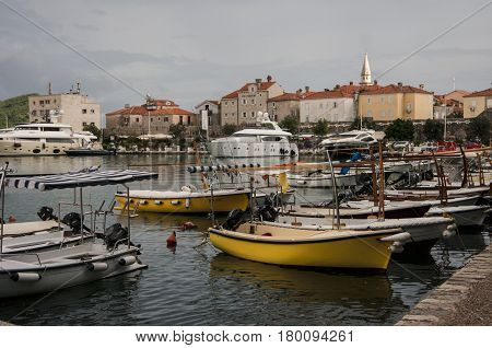 Yachts at the sea moorage against the backdrop of the old city