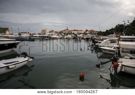 Yachts at sea berth against the backdrop of the old city